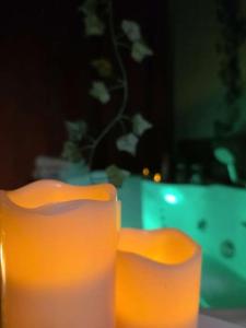 two orange chairs sitting on top of a table at Love room - L'escapade du désir in Trouillas +29 photos