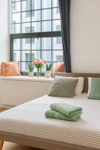 Ένα ή περισσότερα κρεβάτια σε δωμάτιο στο Hola Apartamenty Pomorska