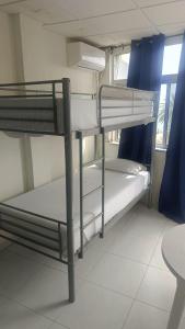 a room with two bunk beds in a building at tenerife only rooms near to beach in Los Cristianos
