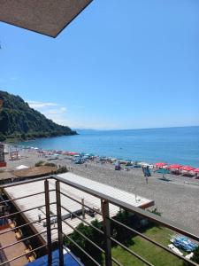 a view of a beach with umbrellas and the ocean at Hotel Lazuri in Kvariati