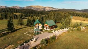 an aerial view of a house in the mountains at Villas Hidden Paradise in Žabljak