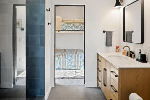 a bathroom with a shower and a sink at OMI Combo in Creede, CO in Creede +32 photos