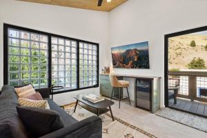 a living room with a couch and a table at OMI Combo in Creede, CO in Creede