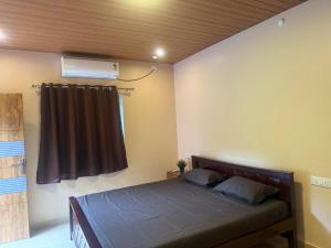 Postel nebo postele na pokoji v ubytování French Resort