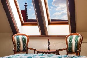 Postel nebo postele na pokoji v ubytování Arcadia Boutique Hotel
