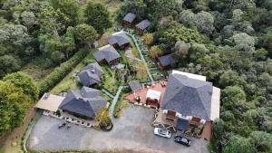 an aerial view of a large house with a yard at Pousada Chales da Mantiqueira - Campos do Jordão in Campos do Jordão