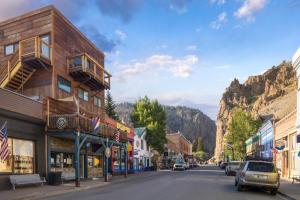 a street in a town with a mountain in the background at OMI Loft in Creede, CO in Creede