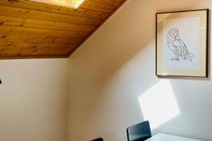 a room with a drawing of a bird on the ceiling at Bright Apartment at the Foot of the Slopes Mountain View Sleeps 4 in Vars