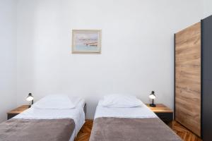 Ένα ή περισσότερα κρεβάτια σε δωμάτιο στο Apartments Andrija