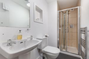 a bathroom with a sink and a toilet and a shower at Lawhead Road East in St. Andrews +25 photos