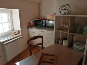 Η κουζίνα ή μικρή κουζίνα στο Le Patio - 2 Chambres à coucher