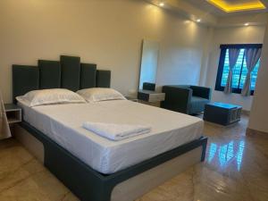 a bedroom with a large bed in a room at GOLDEN VISTA RESORT - 10 Minute From Mayapur Temple in Krishnanagar