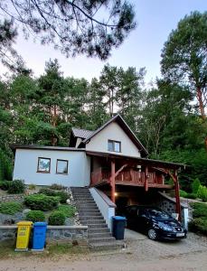 a house with a car parked in front of it at Zofia in Struga