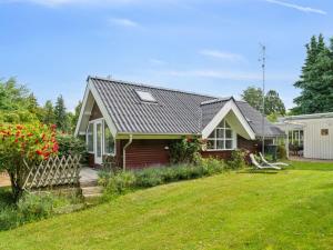 a small house with a yard at Holiday Home Helfrida - 925m from the sea by Interhome in Nyrup