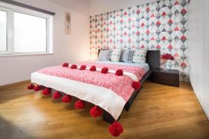 Postel nebo postele na pokoji v ubytování Alexandra's City Center Apartment I