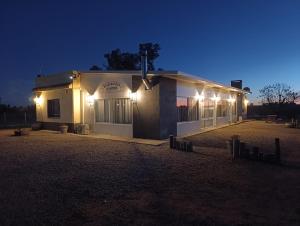 a building with lights on it at night at La Martinna 3 in Trinidad