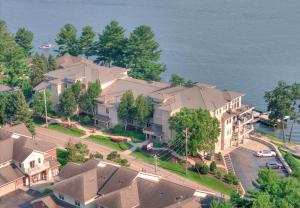 an aerial view of a large house next to the water at Luxury Lakefront Condo in Wisconsin Dells in Lake Delton