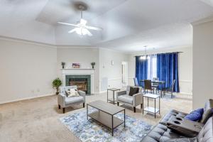 a living room with a couch and a fireplace at Home with Fenced Yard about 12 Mi to Dtwn Montgomery in Mitylene