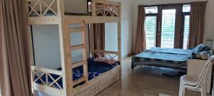 a bedroom with two bunk beds and a bed at View Point Stay in Yelagiri