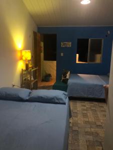 Ένα ή περισσότερα κρεβάτια σε δωμάτιο στο Mahalo Hostel