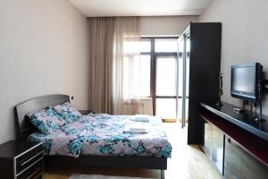 Ένα ή περισσότερα κρεβάτια σε δωμάτιο στο 2 bathrooms apartment