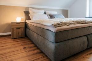 Katil atau katil-katil dalam bilik di Ferienhaus Maarwinkel