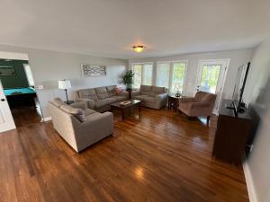 a living room with two couches and a television at Wine Down in Hammondsport