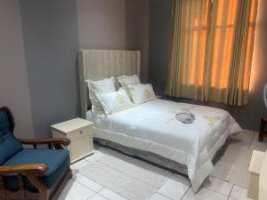 Una cama o camas en una habitación de Unit 12 Damara Gardens