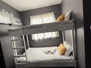a bunk bed in a room with a bunk bedutenewayangering at AMS Hostel Butuan City in Butuan
