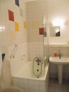 a bathroom with a shower and a tub and a sink at LIMOGES,LA vue, 7e ciel, ascenseur ! in Limoges