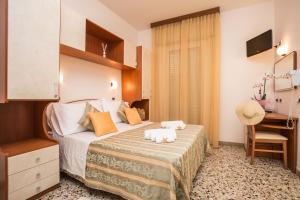 Postel nebo postele na pokoji v ubytování Hotel Oregon