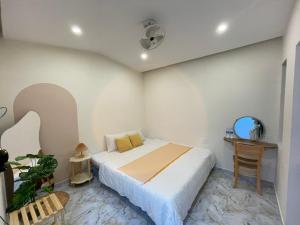 Ένα ή περισσότερα κρεβάτια σε δωμάτιο στο Lune House Da Lat +3 φωτογραφίες