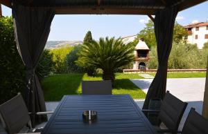 a table and chairs on a patio with a gazebo at Villa STEFY in Fragneto Monforte