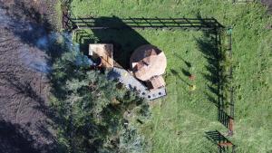 an aerial view of a house in a field at Centro Turístico Epu Pillan Domo in Panguipulli