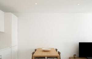 a dining room with a table and chairs at Ocean Nest by Huskalia in Puerto Naos +13 photos