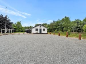 a white house with a driveway in front of it at Apartment Wisti - 20km from the sea by Interhome in Skærbæk
