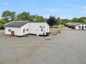 a large white building with a parking lot at Apartment Wisti - 20km from the sea by Interhome in Skærbæk