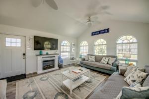 a living room with a couch and a fireplace at 214-216 Pearl Entire House in Fort Myers Beach