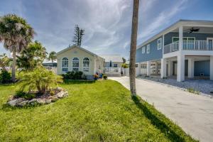 a house with a palm tree in front of it at 214-216 Pearl Entire House in Fort Myers Beach
