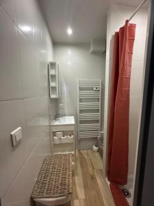 a bathroom with a bench and a sink in it at Studio in Cogolin