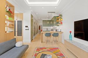a living room with a couch and a kitchen at 1 Bed Flat in London in London
