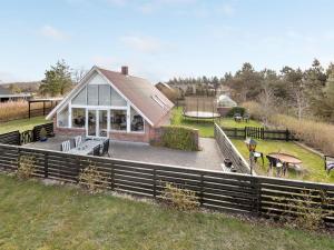 a house with a pavilion with a playground at Holiday Home Gizella - 850m to the fjord by Interhome in Skjern