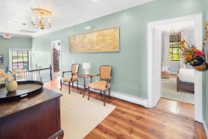 a living room with a table and chairs at The Hill in Providence