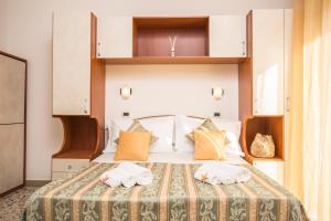 Postel nebo postele na pokoji v ubytování Hotel Oregon