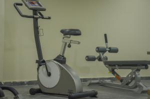 a gym with two exercise bikes in a room at Thassos Imperial Resort in Skala Rachoniou