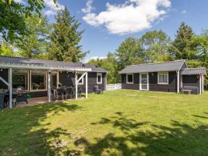 a house with a yard in front of it at Holiday Home Ulrike - 600m to the fjord by Interhome in Ulfborg