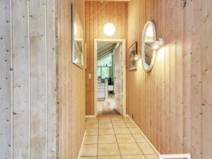 a hallway with wood paneled walls and a mirror at Holiday Home Ellica - 50km from the sea by Interhome in Give +20 photos