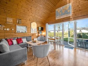 a living room with a couch and a table at Holiday Home Terese - 45km from the sea by Interhome in Grindsted