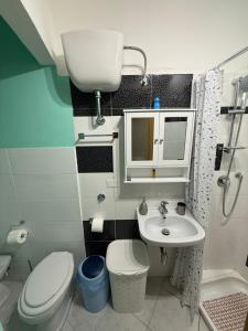 a small bathroom with a toilet and a sink at Il mondo di Leo in Tocco da Casauria +58 photos