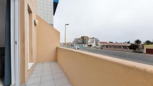 a balcony with a view of a city street at Namib Nook in Swakopmund